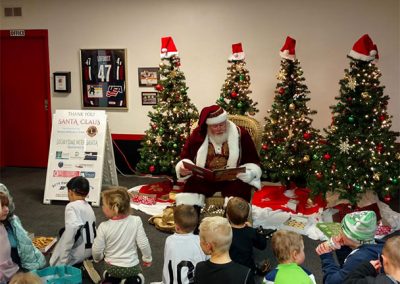 Santa Dan Reading To A Classroom