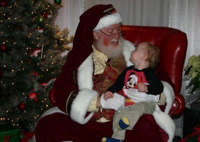 Santa Dan Being Goofy With An Infant