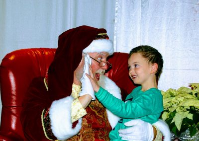 Santa Dan High Fiving A Child