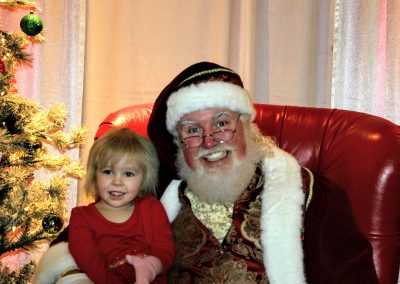 Santa Dan Showing His BIG Smile With A Child