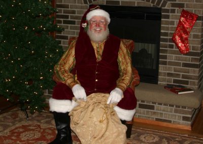 Santa Dan Getting Ready To Hand Out Presents To The Children