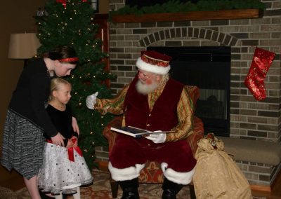 Santa Dan & Skeptical Looking Young Lady