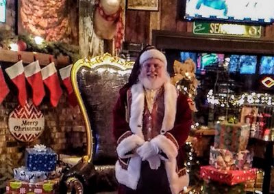 Santa Dan Posing With Presents