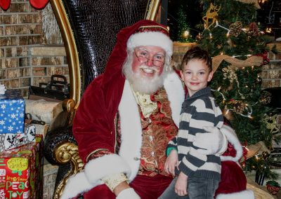 Santa Dan & Young Boy Smiling For The Camera